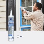 Image of a man applying GE Paintable Silicone sealant to window trim, showcasing the white color option.