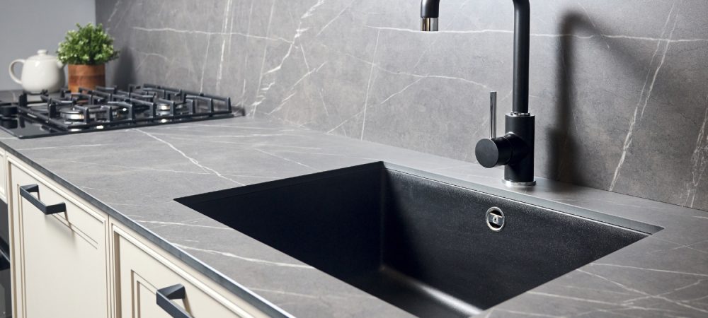Modern kitchen with a black undermount sink.
