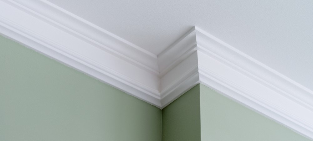 Use caulk to fill in large gaps in your crown molding.