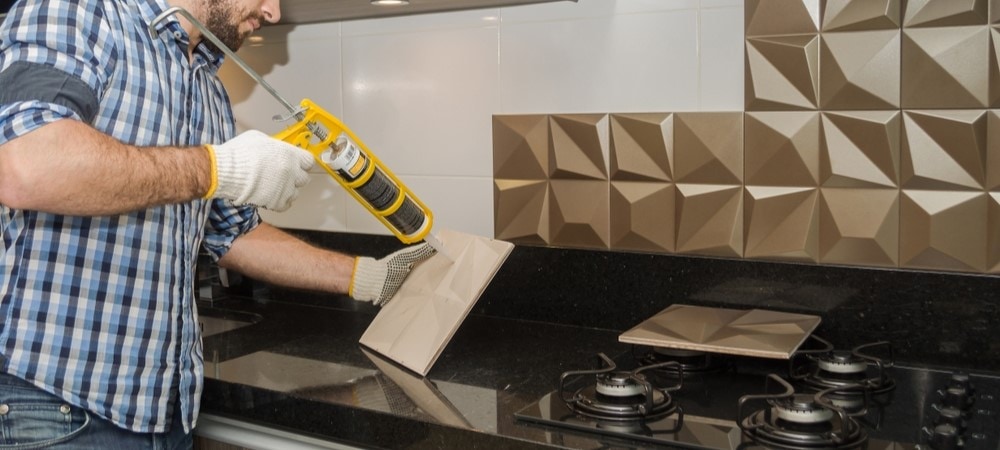 This image shows a kitchen sink backsplash, which is an important part of sealing a kitchen counter.