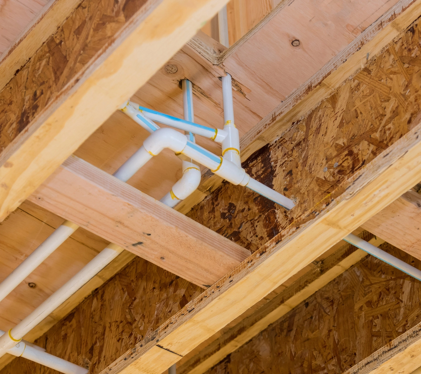 A gap around a pipe in an attic.