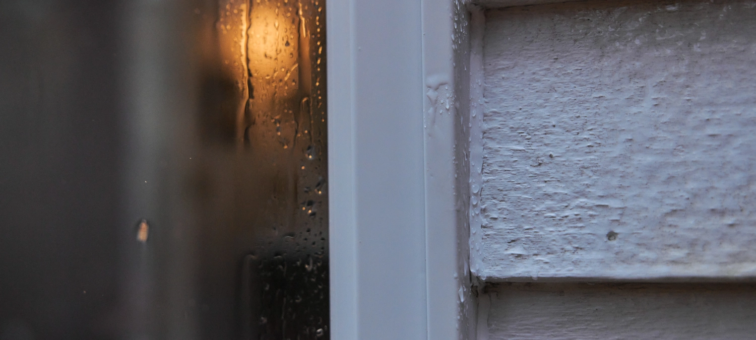 A leaky window seal on a rainy day.