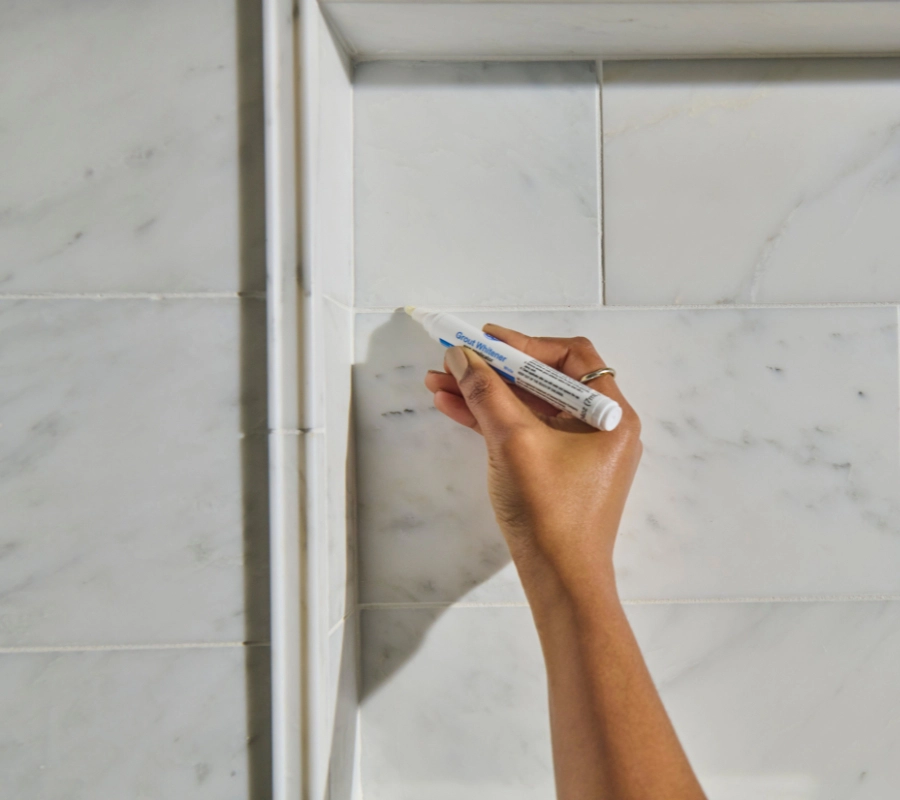 A decorative tile wall in a bathroom.