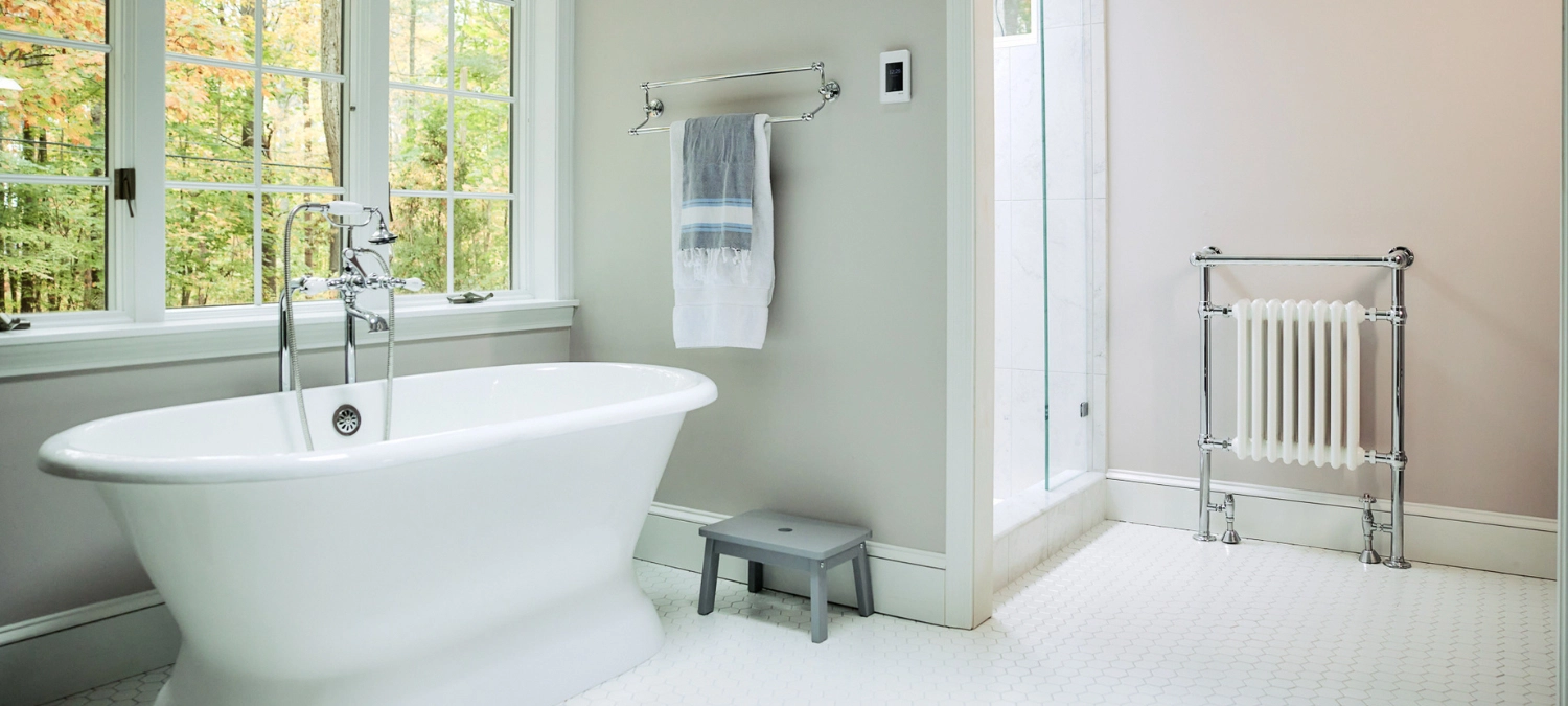 Modern bathroom with a clean bathtub area, ideal result after you recaulk your bathtub.
