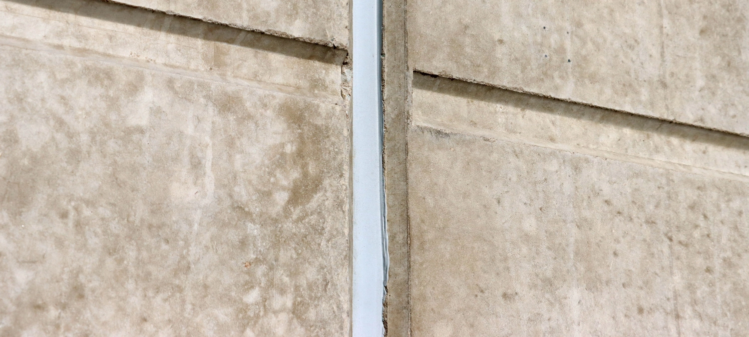 Silicone sealant in a concrete joint.