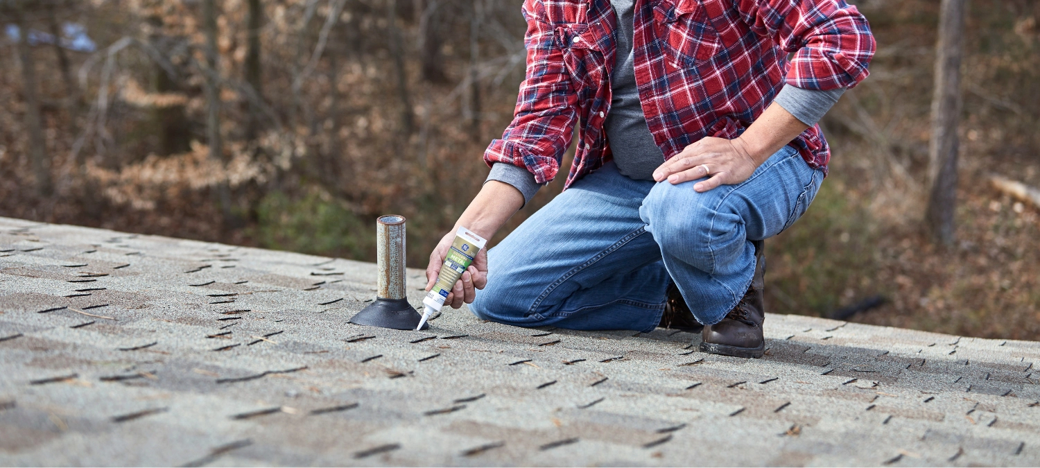 Applying GE Metal Silicone Sealant to a vent pipe flashing on a residential roof