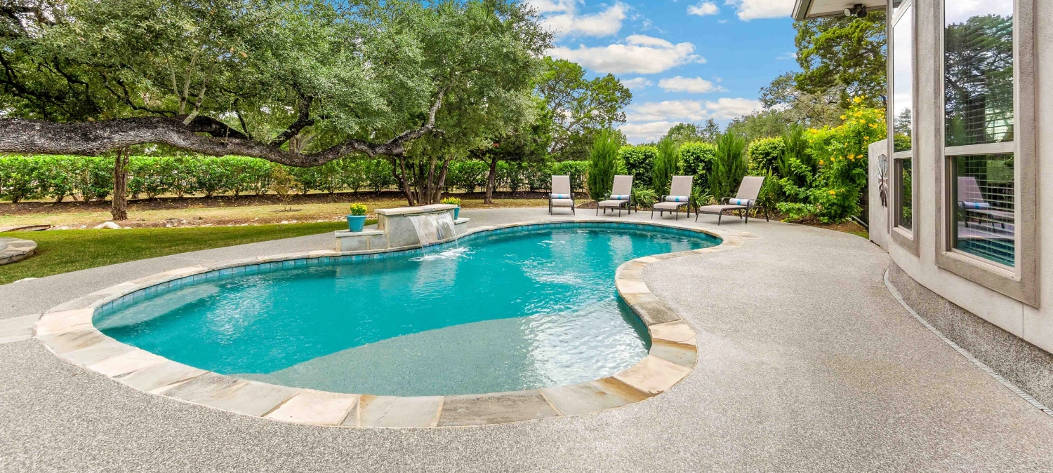 A pool and patio area with proper poolside waterproofing using silicone sealant.