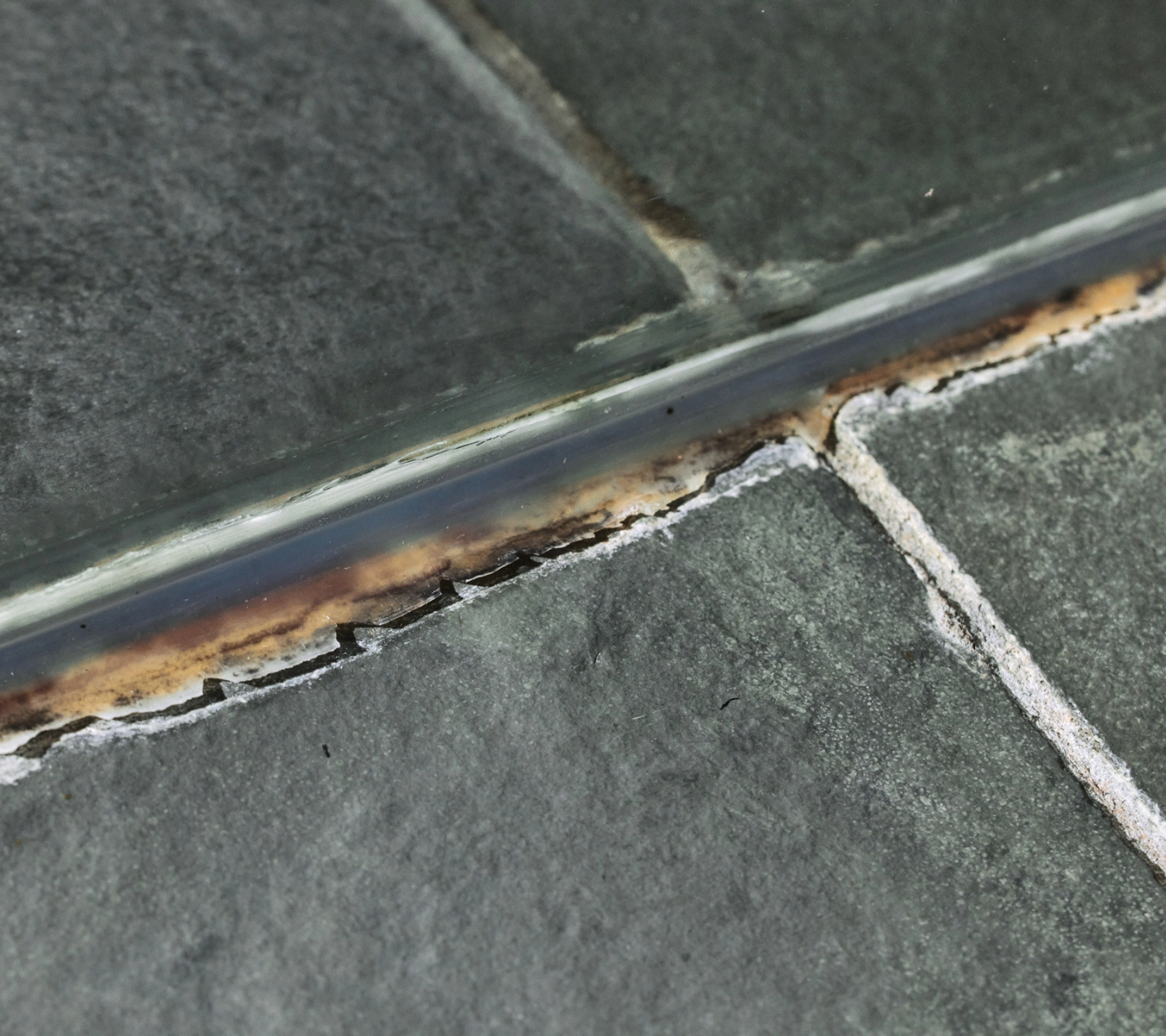 Old, moldy bathroom sealant.