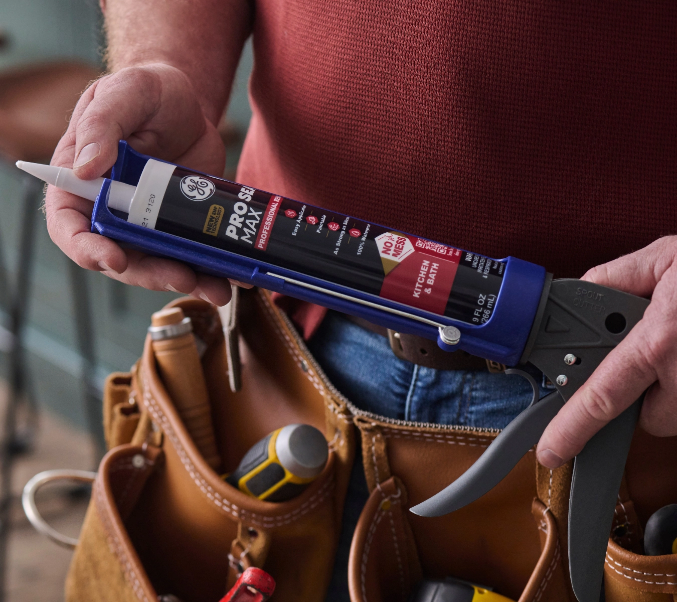 Silicone sealant loaded into caulking gun for easy application.