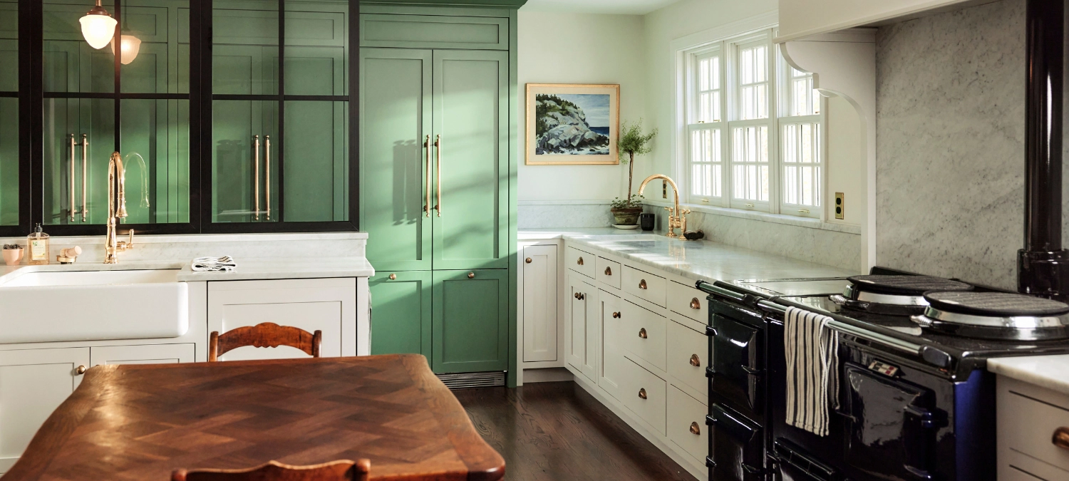 Modern kitchen with sealed counters, backsplash, and sink fixtures.
