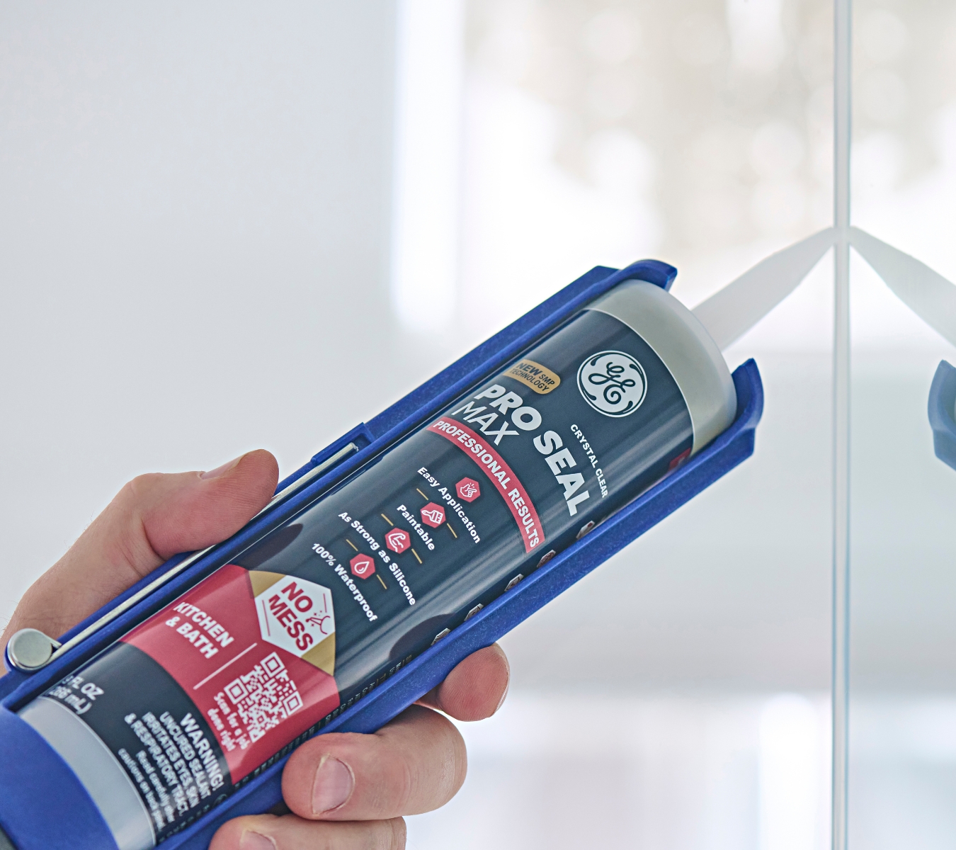 Fresh silicone sealant applied around a shower.