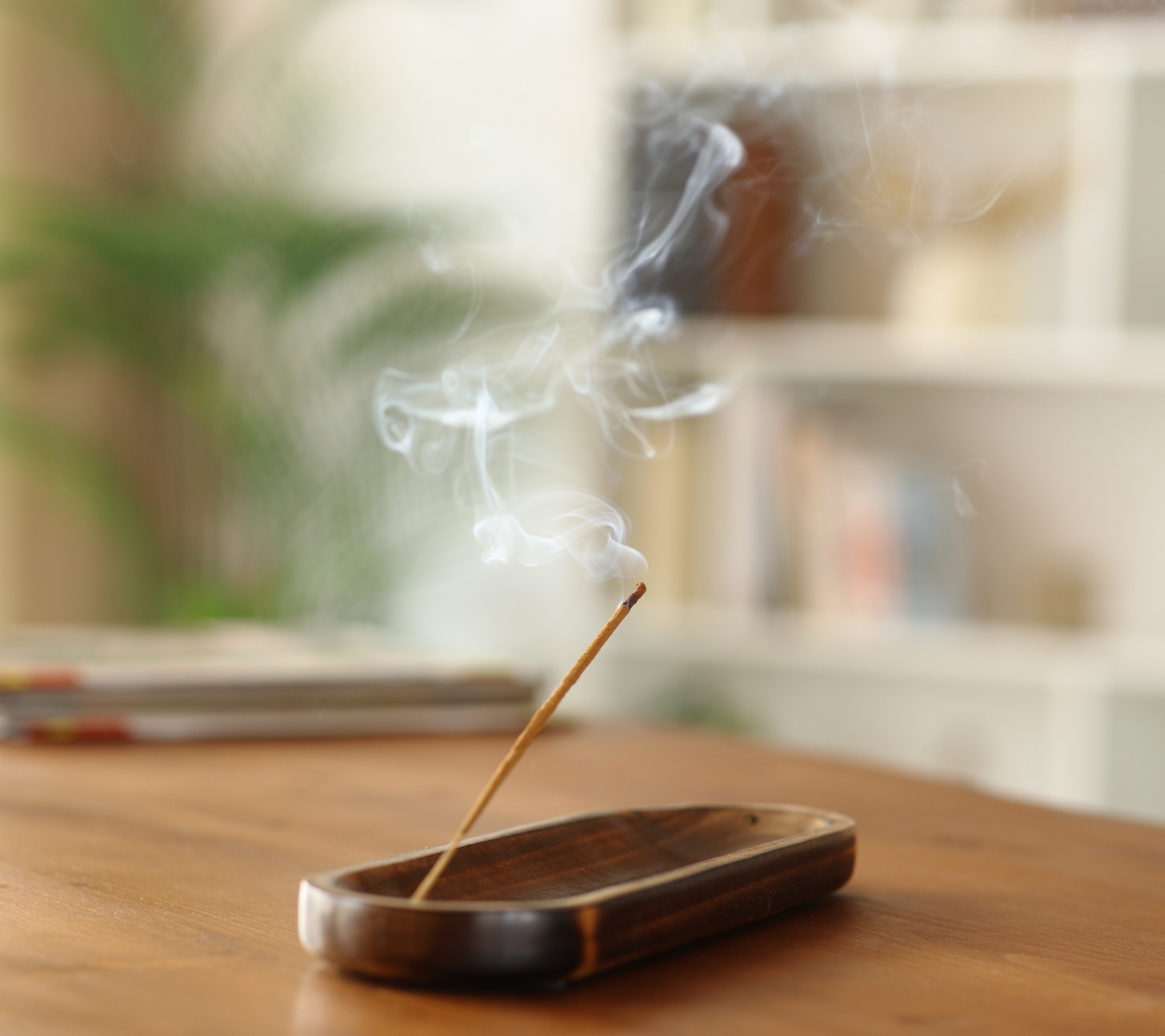 A homeowner runs an incense stick to find air movement.