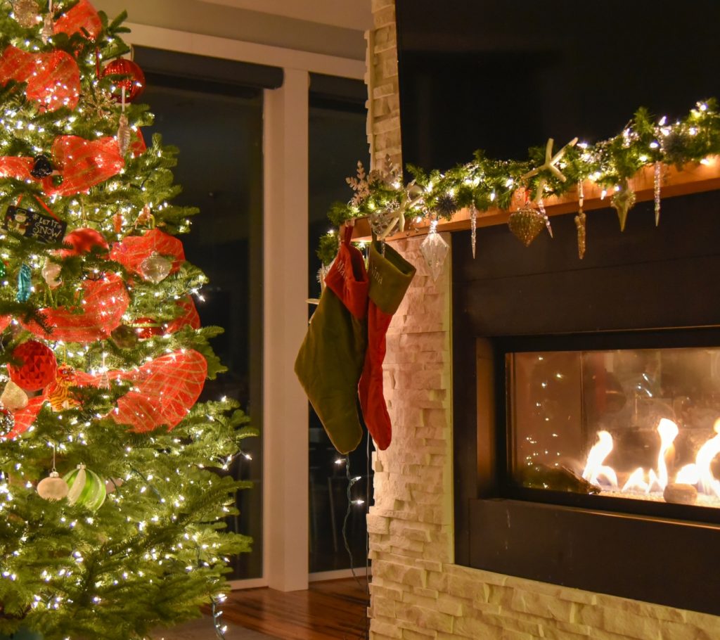 Christmas lights indoors that were hung with adhesive-backed hooks.