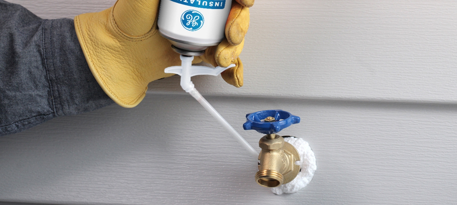 Insulating foam around a pipe penetration.