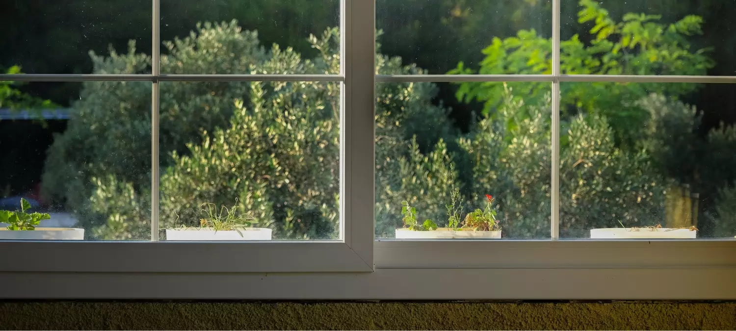 Image of an older home’s windows that will need resealed.