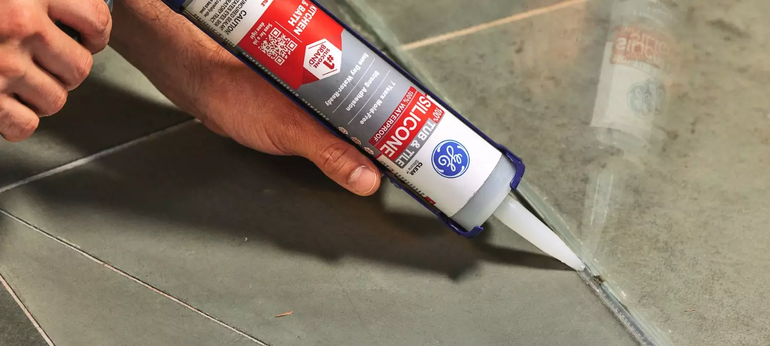 A photo of GE Tub & Tile Silicone Sealant being applied
