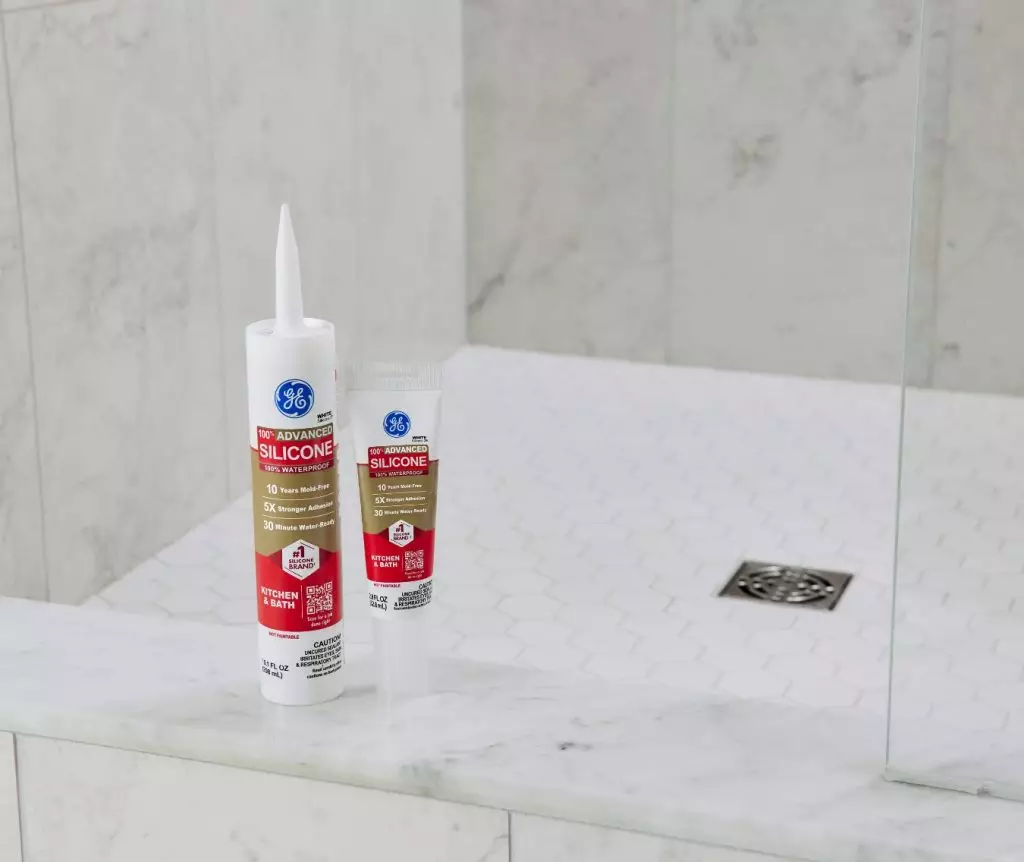 A photo of a cartridge and squeeze tube of GE Advanced Silicone Kitchen & Bath Sealant